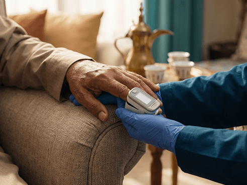 Nurse checking a patient's oxygen level at home