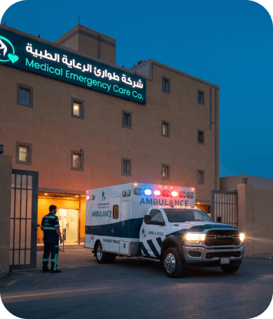 Medical Emergency Care building with ambulance at night